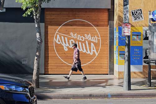 human man walking beside take care always shutter door person