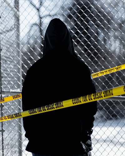 apparel silhouette of person near cyclone fence team