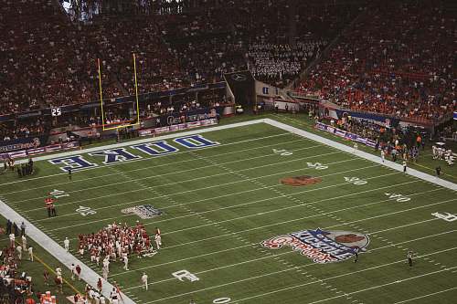 human aerial photography of football field building