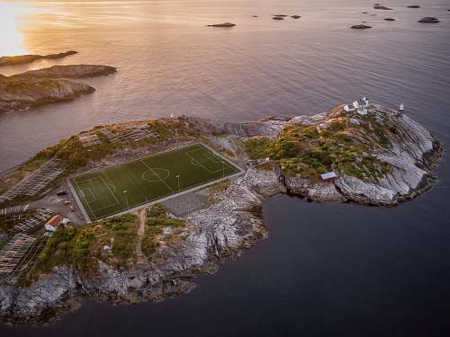 building aerial photography of soccer field on island arena