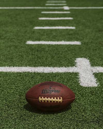 building brown Wilson football on field sports