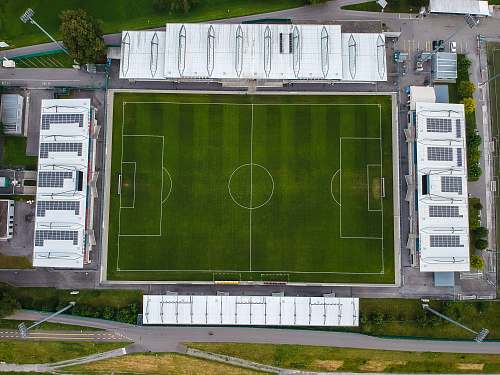 green soccer field building