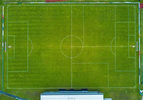 green aerial photo of soccer field field