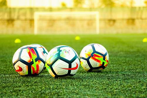 soccer three white-and-black soccer balls on field soccer ball