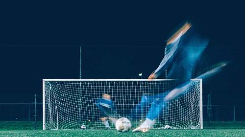 sport timelapse photo of soccer player kicking ball soccer