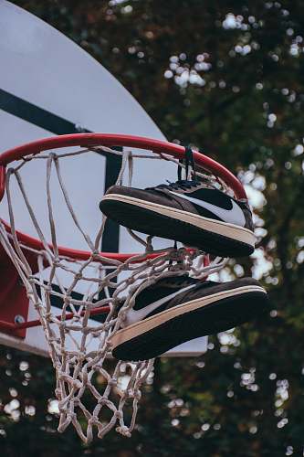 hoop hanged shoes on basketball hoop arras