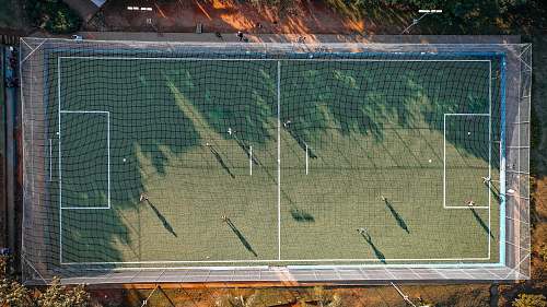field aerial photo of soccer field people