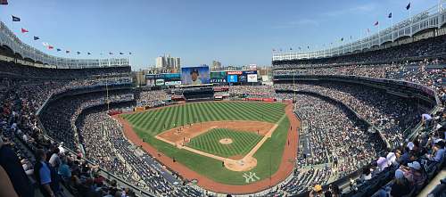 person aerial photography of baseball field building