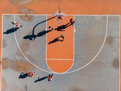 person aerial photography of men playing basketball people