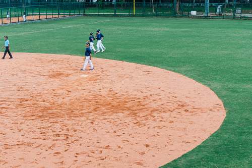 person baseball players on field building