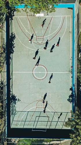 person basketball court during daytime aerial photography people