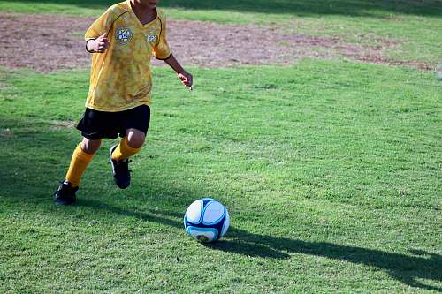 person boy playing soccer people