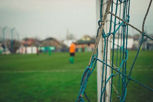 sphere closeup photography of goalpost during daytime people