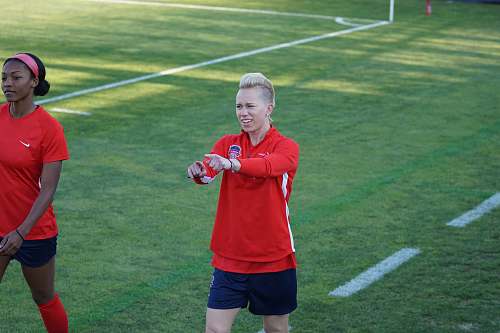 person female football player on red shirt apparel