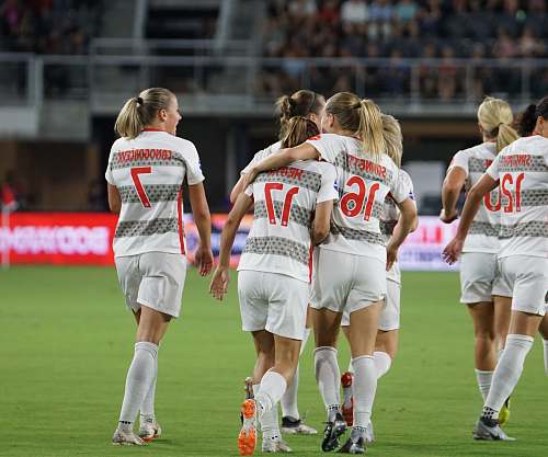 person female soccer team on green grass people