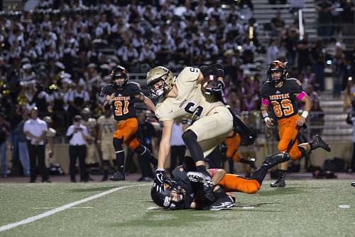 person football player tackling another player in a match people