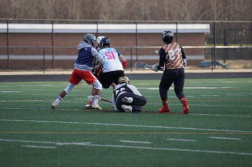 apparel four person playing lacrosse clothing