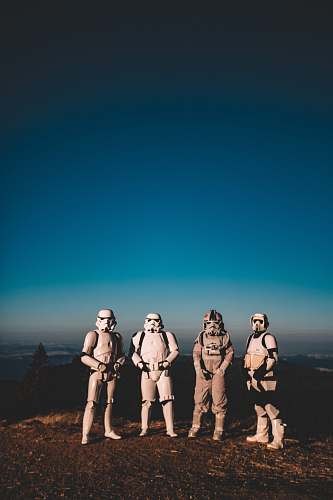 person four person wearing Star Wars Clone Trooper costumes people