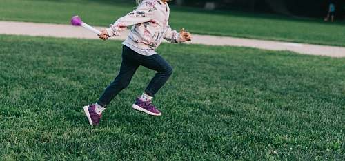 person girl running on green field people