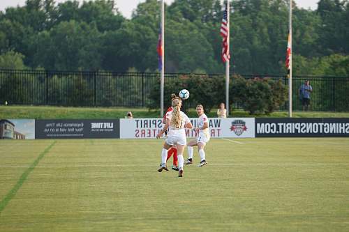 person girls playing soccer people