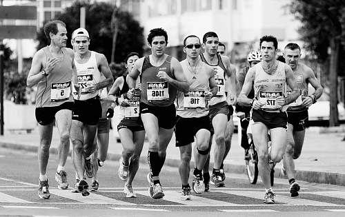 black-and-white grayscale photo of people performing marathon running