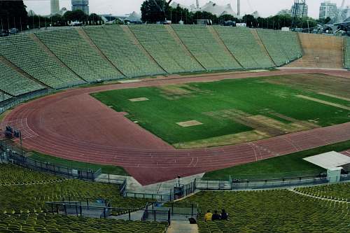 person green football field building