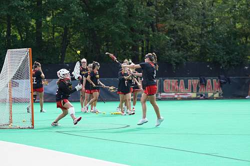 person group of girls playing lacrosse people