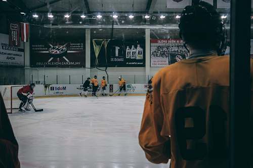 person group of men playing hockey people
