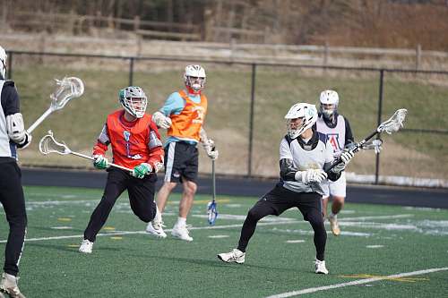 person group of people playing lacrosse apparel