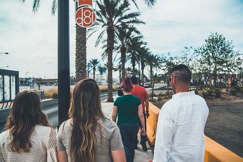 person group of people walking on a sidewalk las vegas
