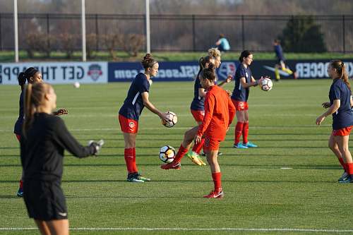 person group of women playing football people