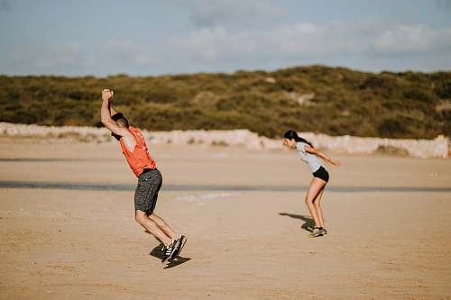 person man and woman jumping people