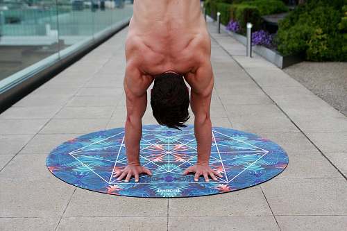 person man doing hand stand people