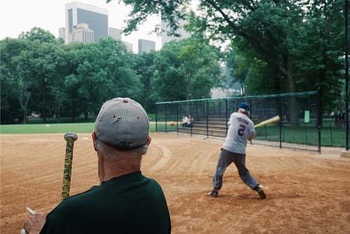 person man holding baseball bat people