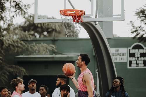 person man holding basketball people