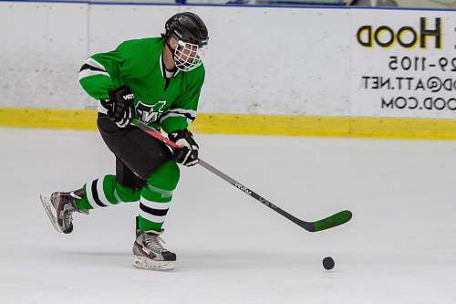 person man in hockey gear playing hockey apparel