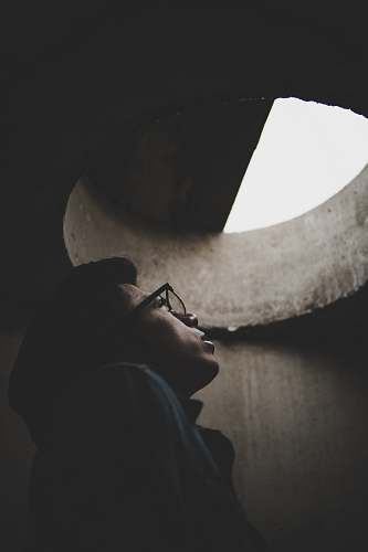 person man inside hole looking up people