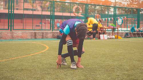 person man on playing field during daytime sports