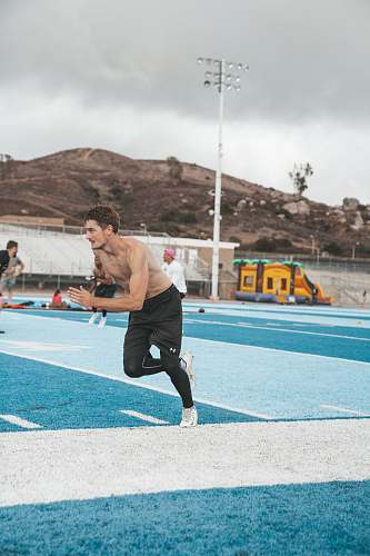person man running at the field sports