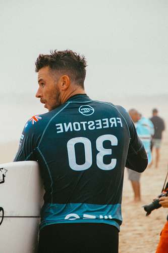 person man wearing Freestone 30 jersey near people sport