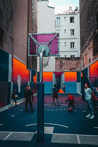 person men and children playing basketball pedestrian