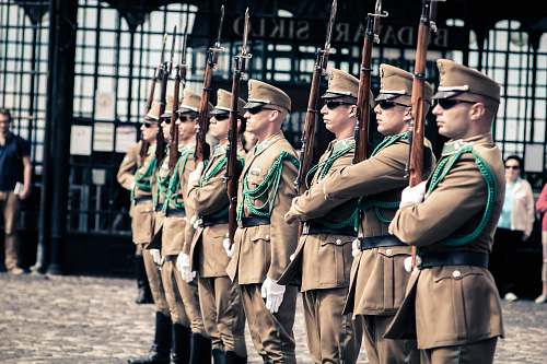 person men holding guns people