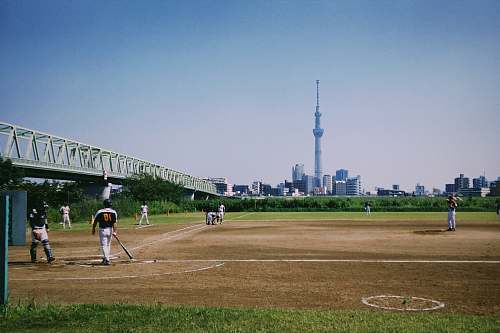 person men playing baseball building