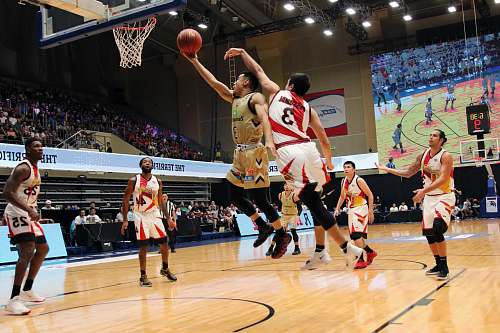 person men playing basketball inside building shoe