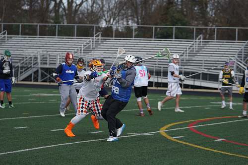 person men playing on field apparel