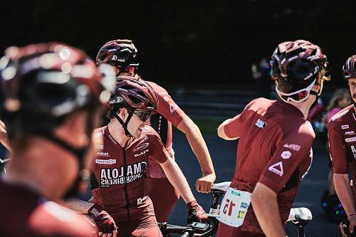 apparel men riding bicycles during daytime person