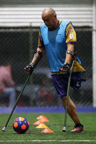 person one-legged man playing soccer apparel