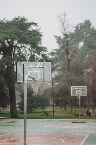 person outdoor basketball court during daytime people