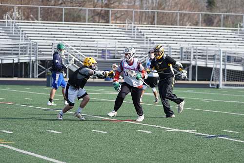 person people playing American football in field during daytime apparel
