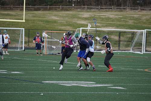 person people playing hockey american football